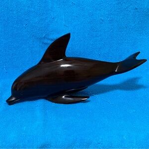 Iron wood dolphin sculpture